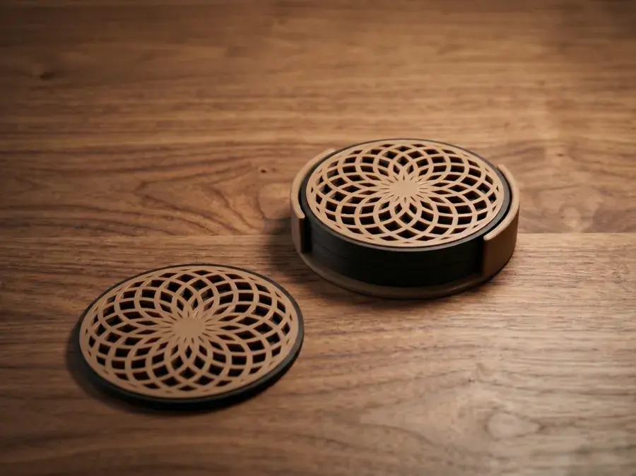 Printed mandala coasters and their holder on a wooden table.